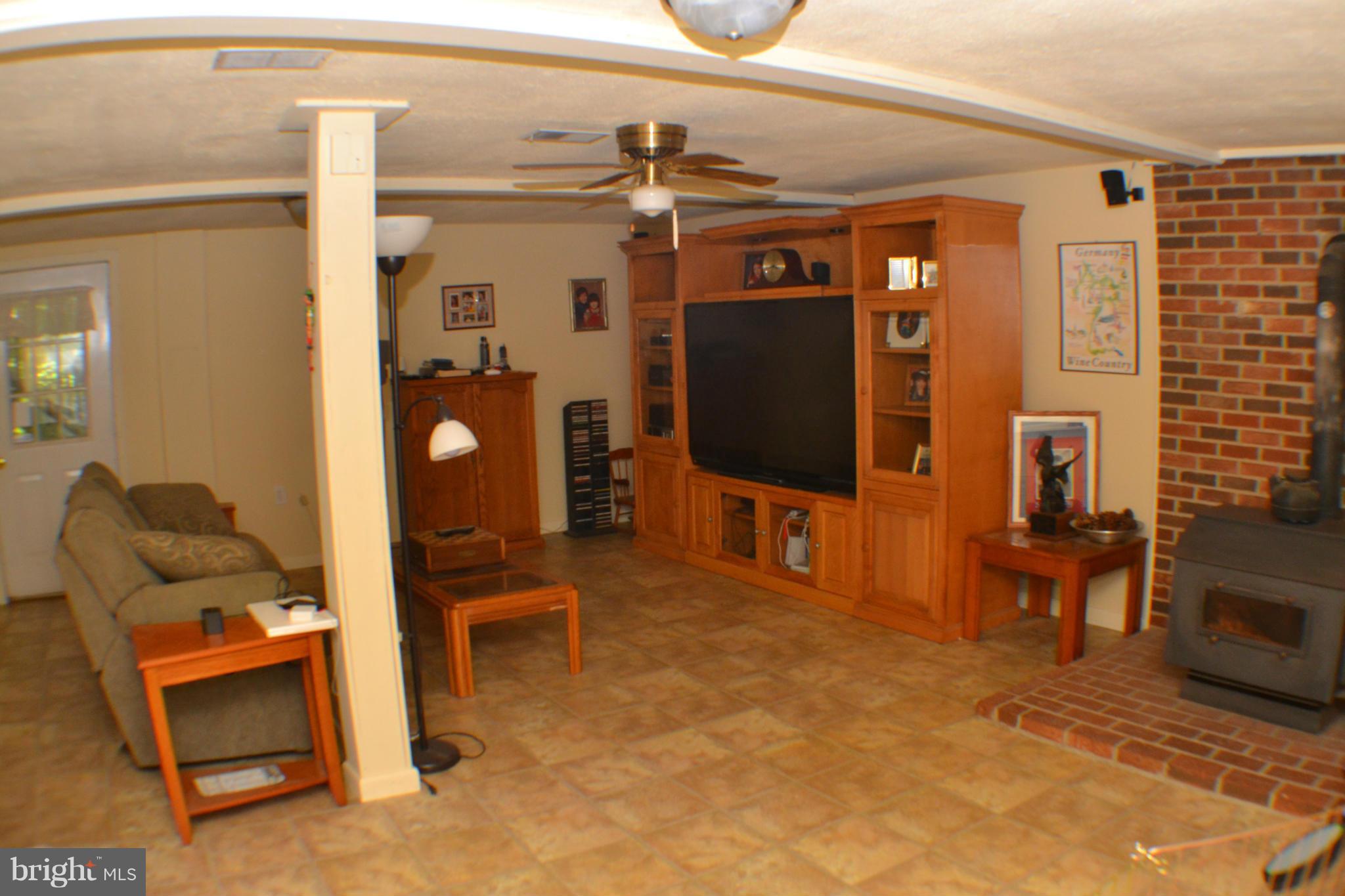9185 Nana Russell Road Owings, MD 20736 - Photo 21 of 30 Family Room with Woodstove