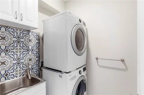 a bedroom with bed and a window