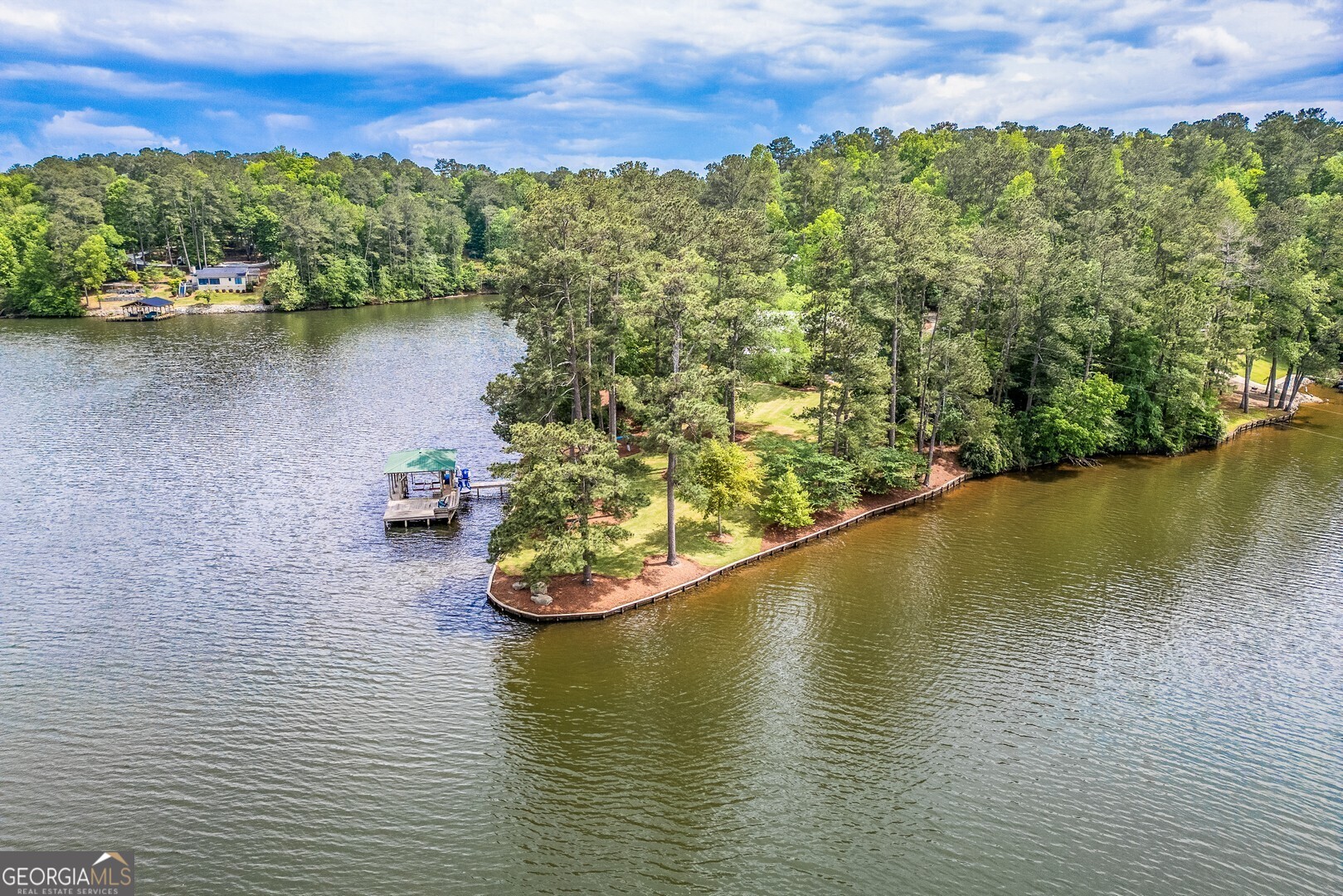 172 Tater Hill Road Jackson, GA 30233 - Photo 16 of 84 an aerial view of residential houses with outdoor space and lake view