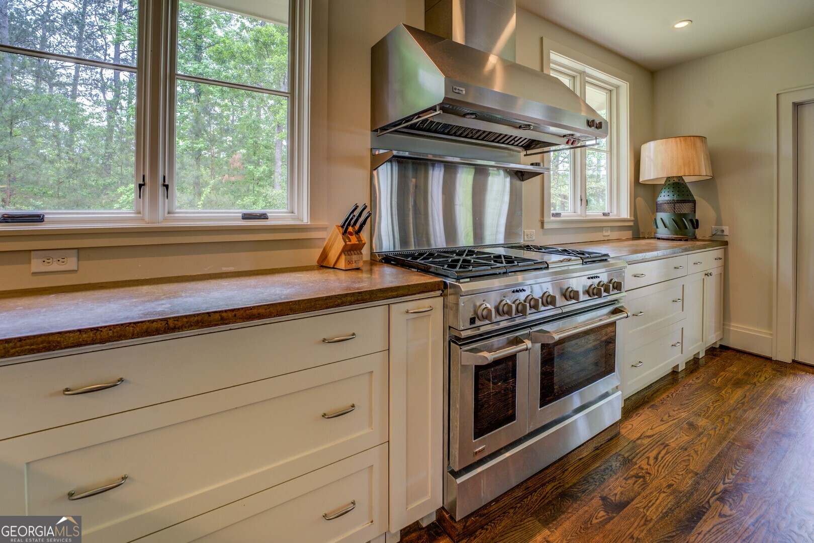 172 Tater Hill Road Jackson, GA 30233 - Photo 31 of 84 a kitchen with a stove and a wooden floor