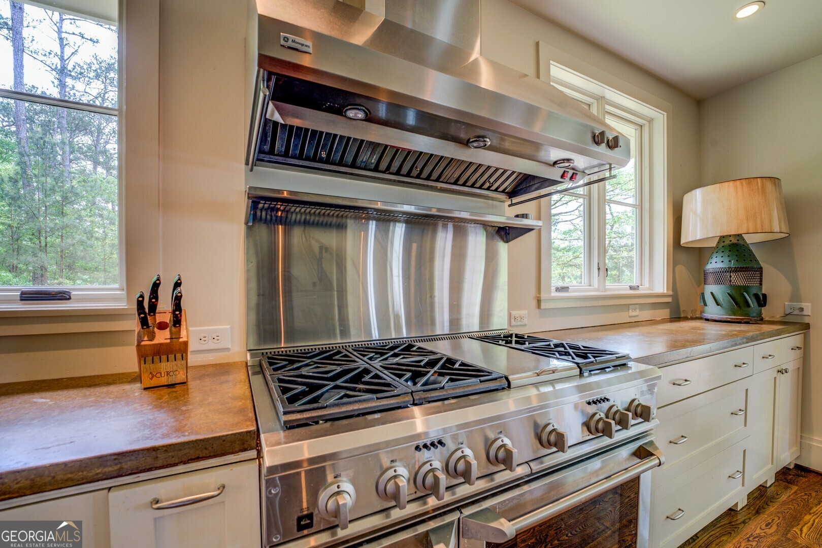 172 Tater Hill Road Jackson, GA 30233 - Photo 33 of 84 a kitchen with stove and cabinets