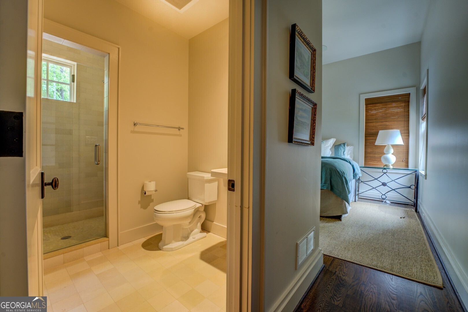 172 Tater Hill Road Jackson, GA 30233 - Photo 49 of 84 a bathroom with a granite countertop toilet and a shower
