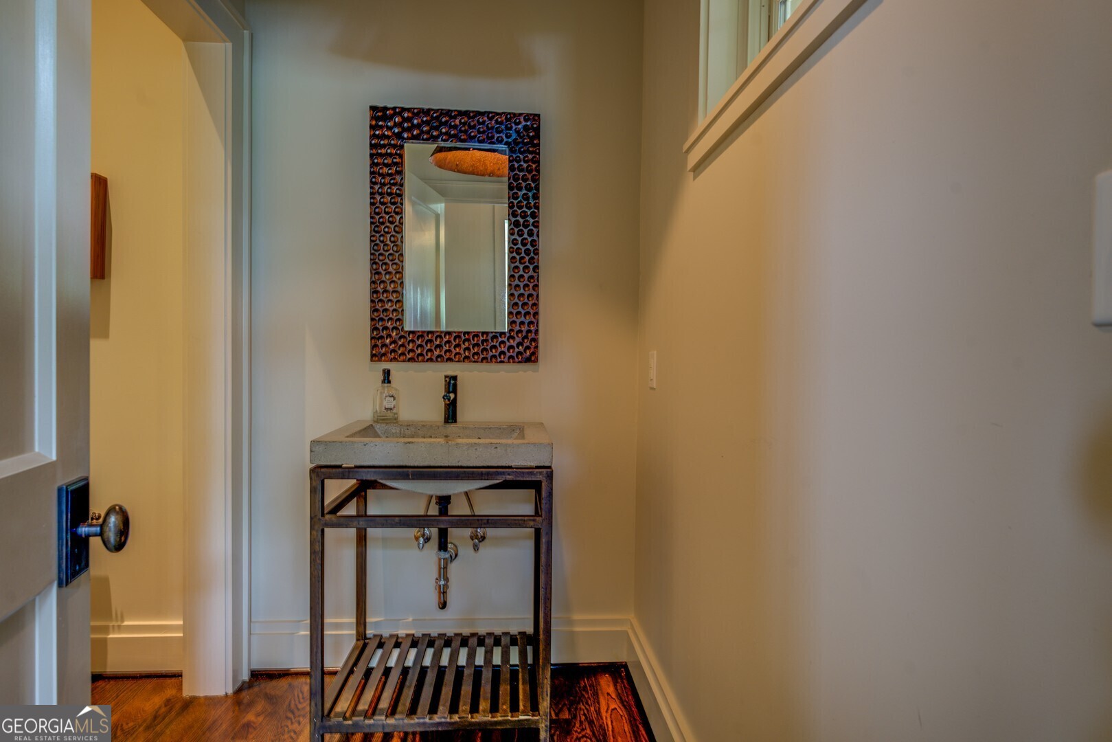 172 Tater Hill Road Jackson, GA 30233 - Photo 52 of 84 a bathroom with a sink a mirror and a toilet