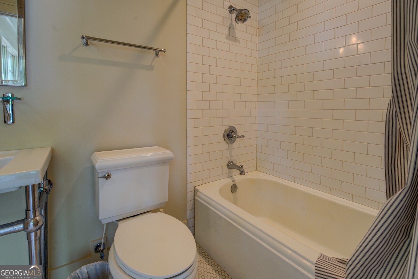 172 Tater Hill Road Jackson, GA 30233 - Photo 57 of 84 a white toilet sitting next to a bath tub