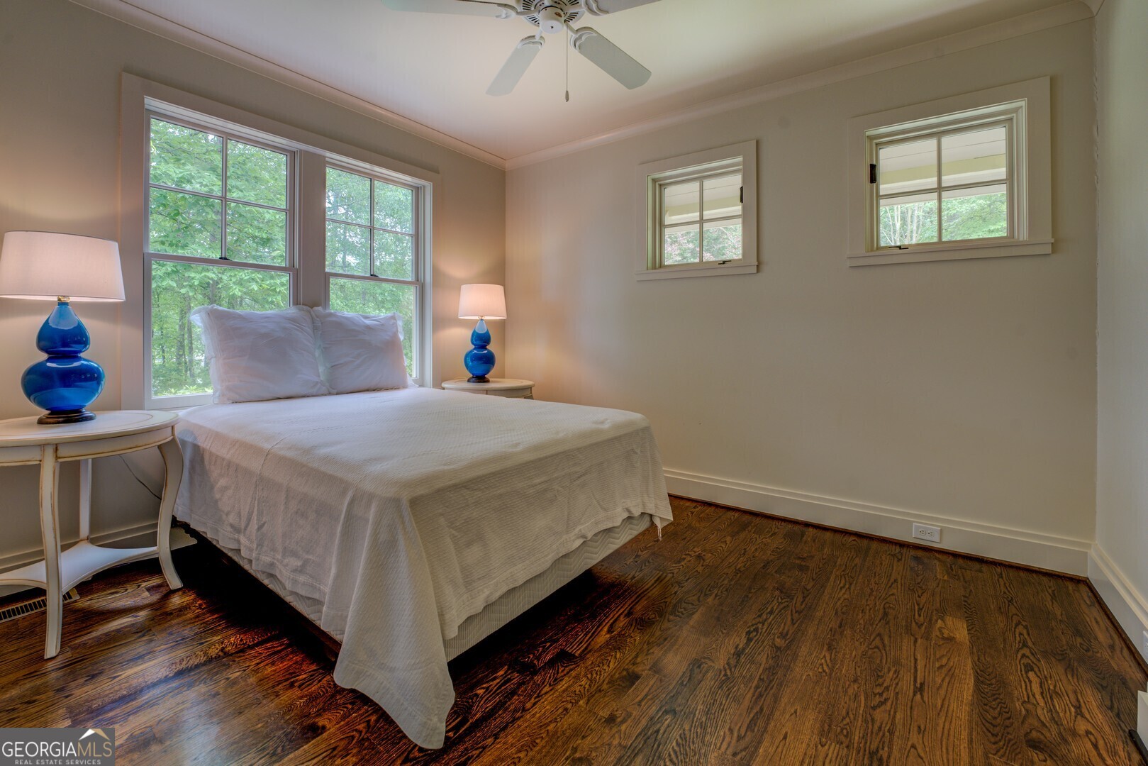 172 Tater Hill Road Jackson, GA 30233 - Photo 61 of 84 a bed sitting in a bedroom next to a window