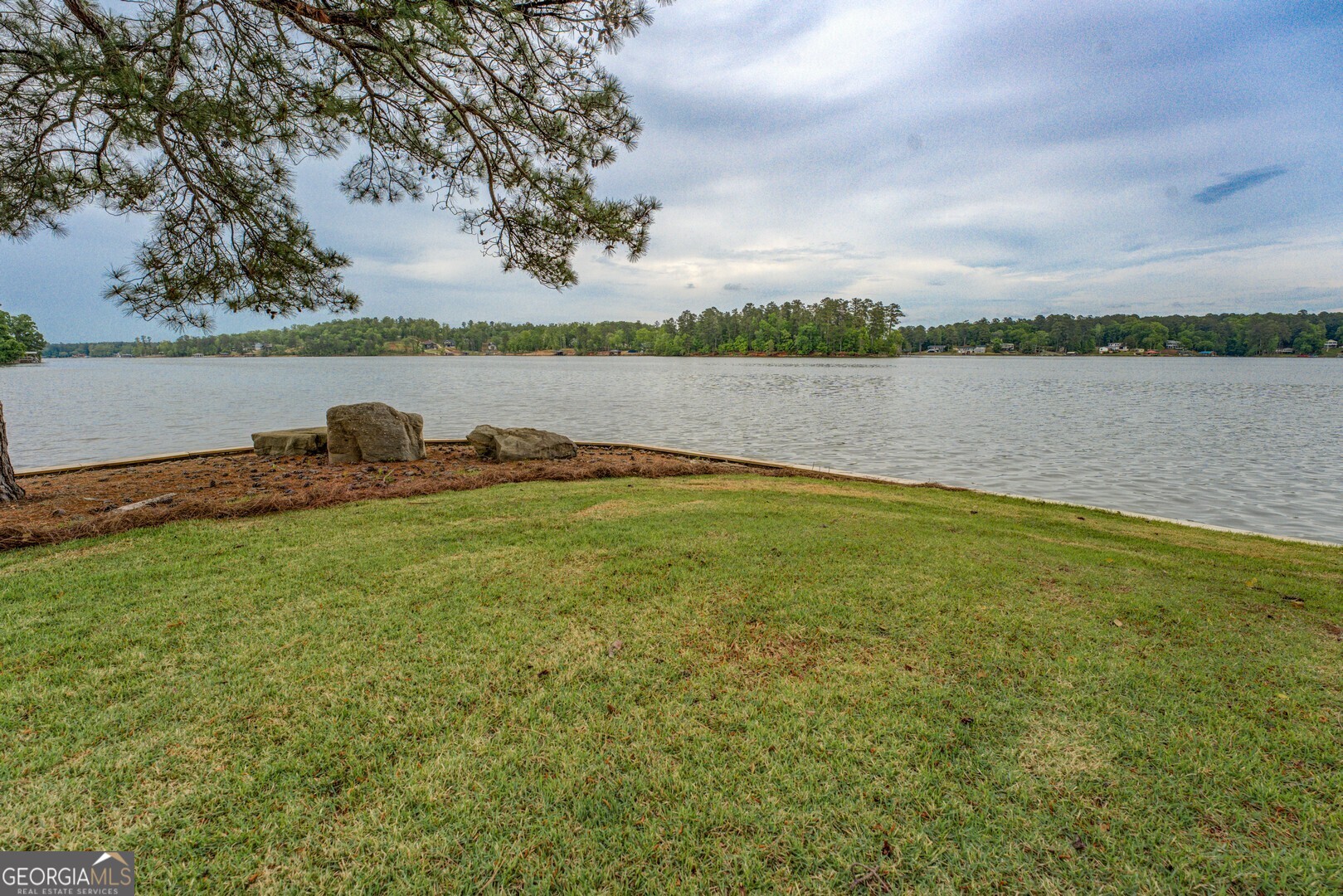 172 Tater Hill Road Jackson, GA 30233 - Photo 74 of 84 a backyard of a house with lots of green space and lake view