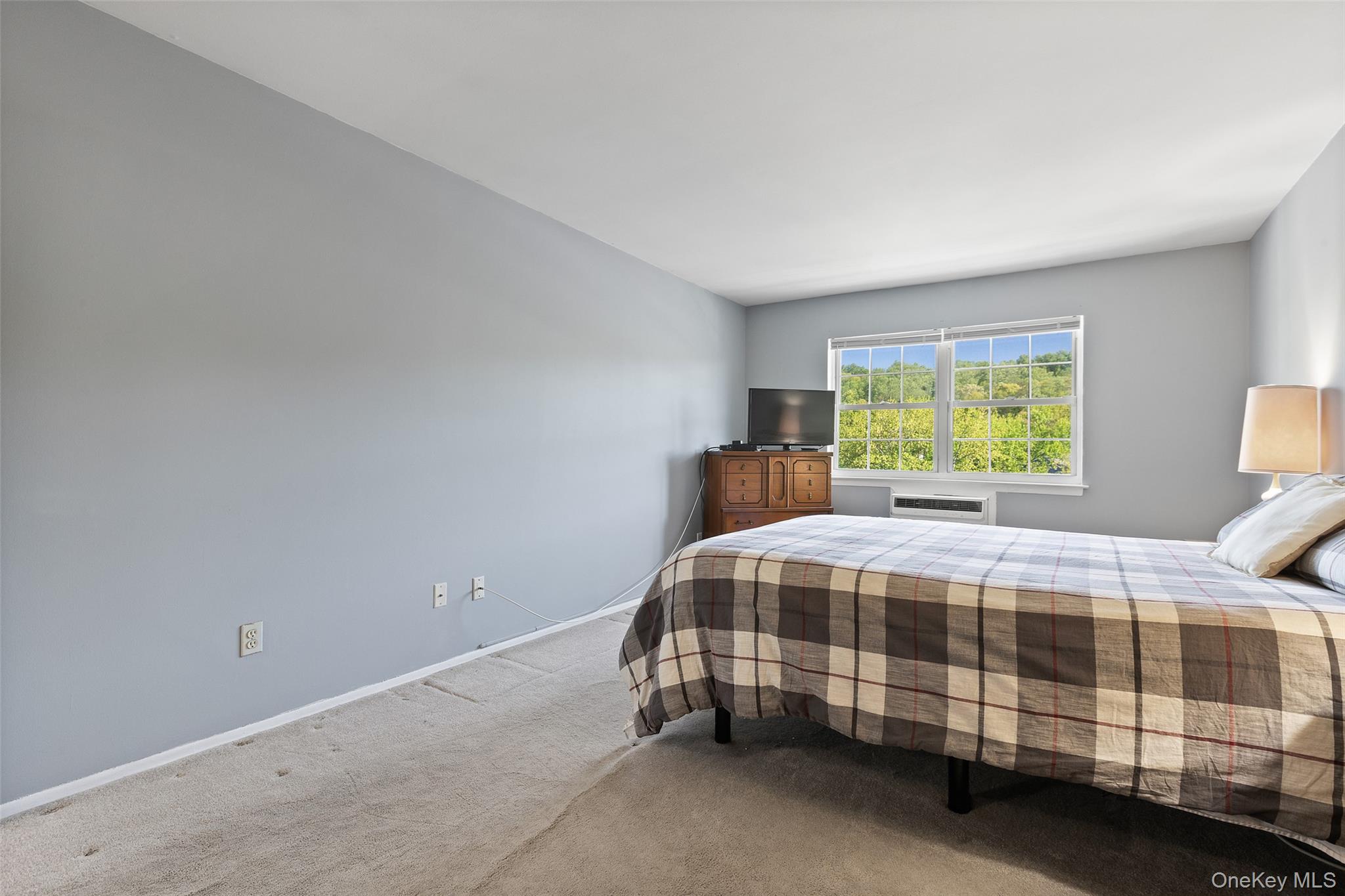 1840 Crompond Road, Unit 5C2 Peekskill, NY 10566 - Photo 13 of 27 a bedroom with a bed and a window
