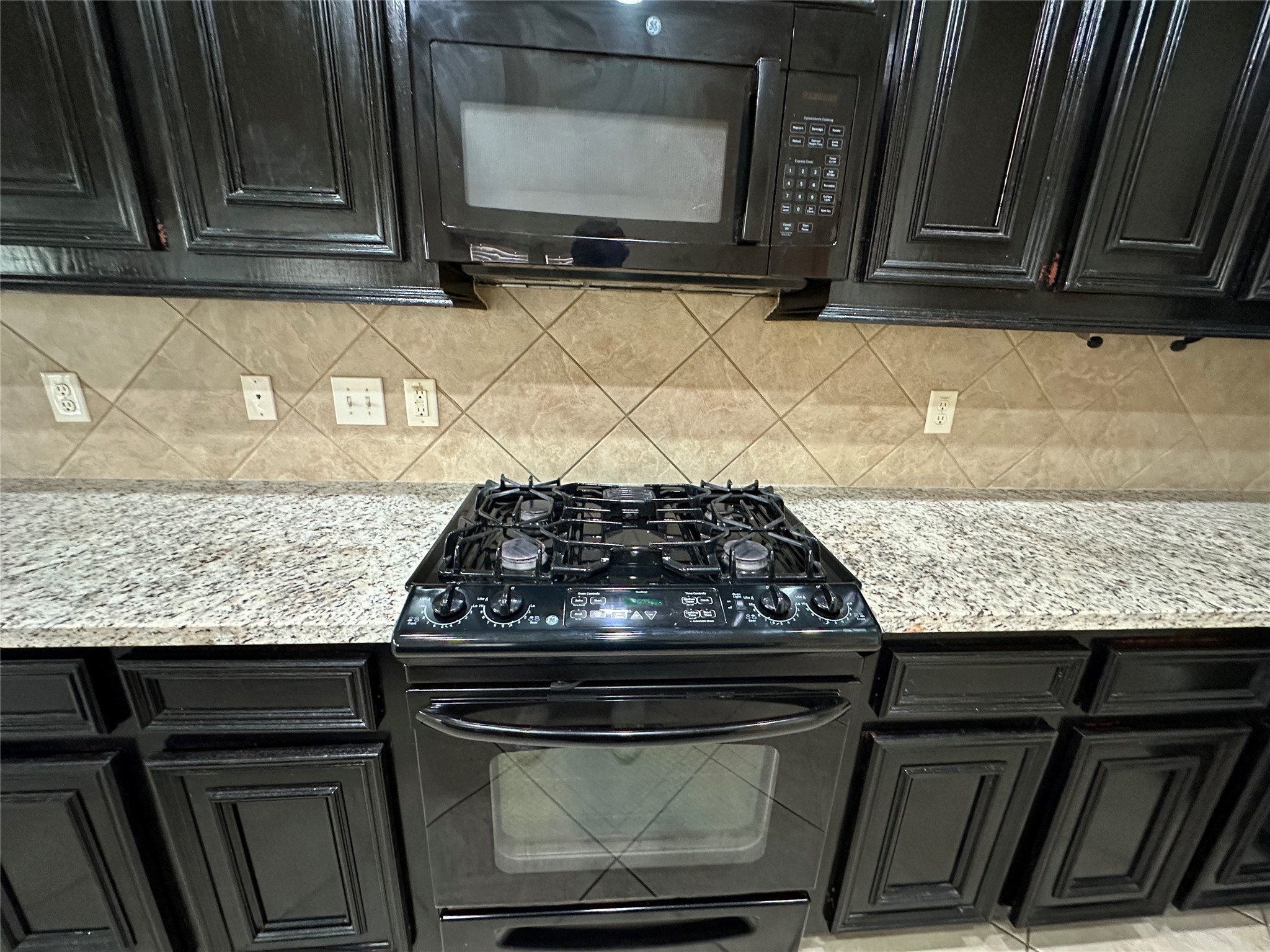 27511 Gatlin Lane Spring, TX 77386 - Photo 16 of 16 a stove top oven sitting inside of a kitchen