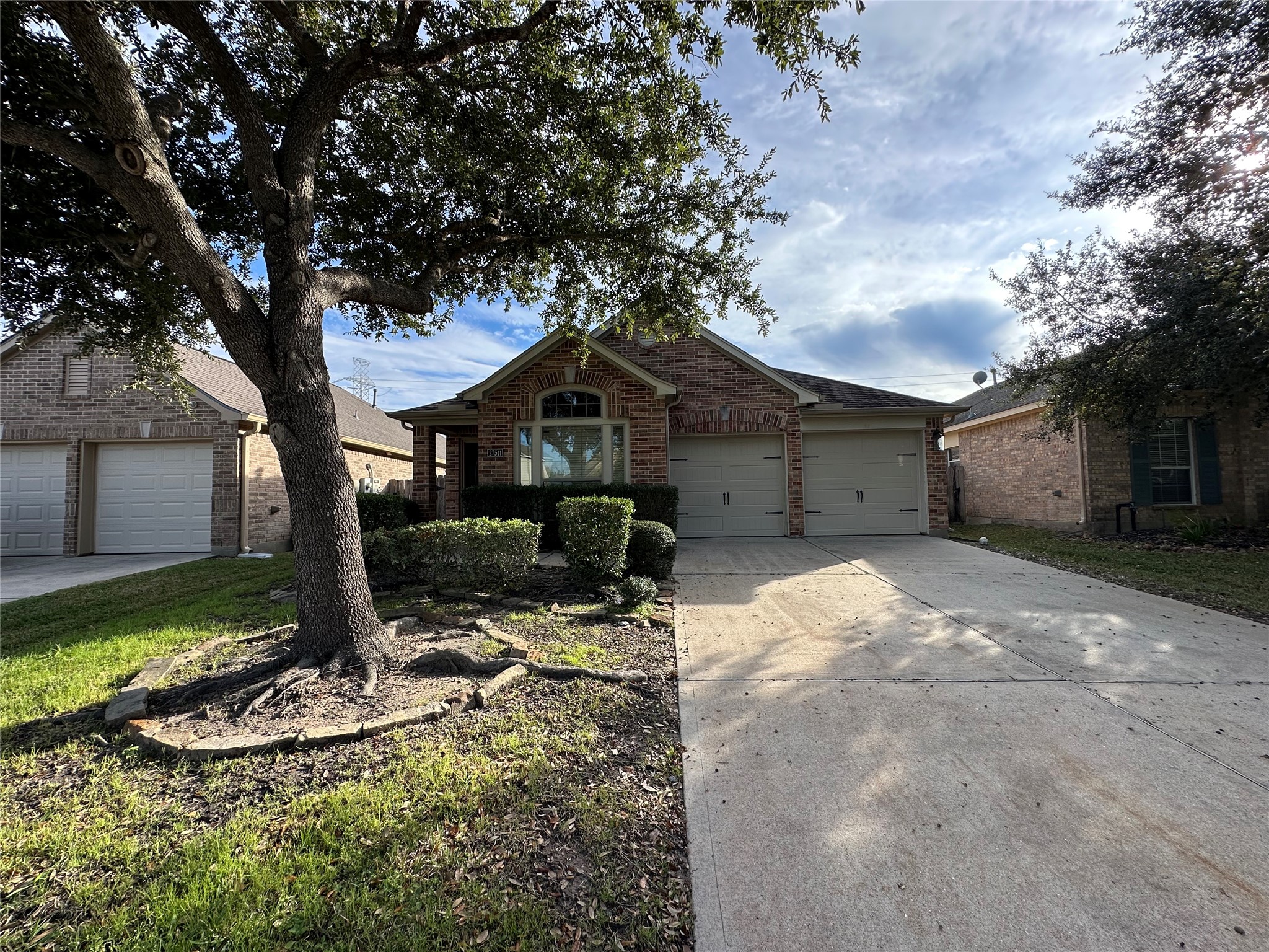 27511 Gatlin Lane Spring, TX 77386 - Photo 2 of 18 This charming single-story home welcomes you with a beautifully maintained lawn, classic brick exterior