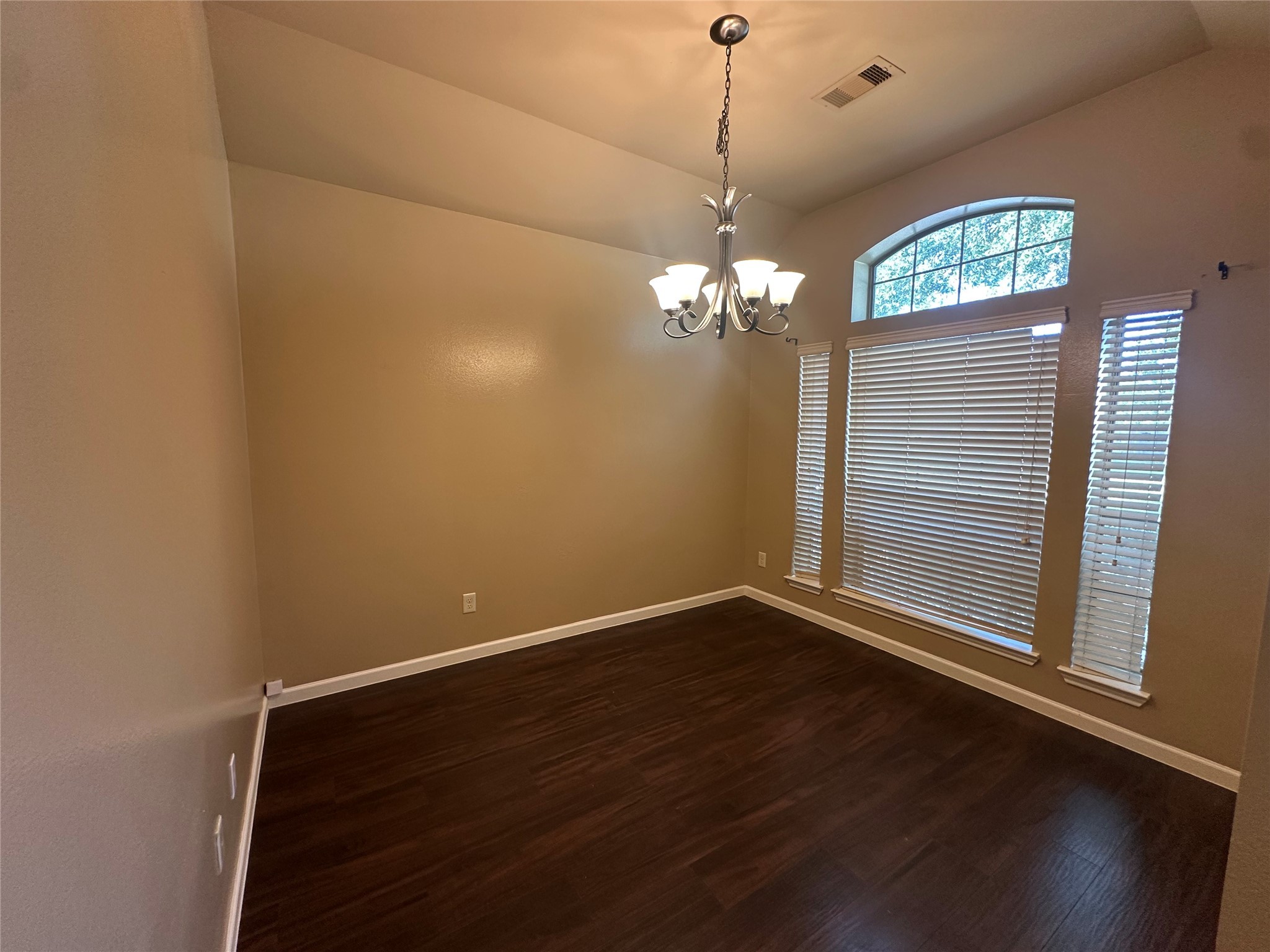 27511 Gatlin Lane Spring, TX 77386 - Photo 3 of 16 a view of an empty room with wooden floor and a window