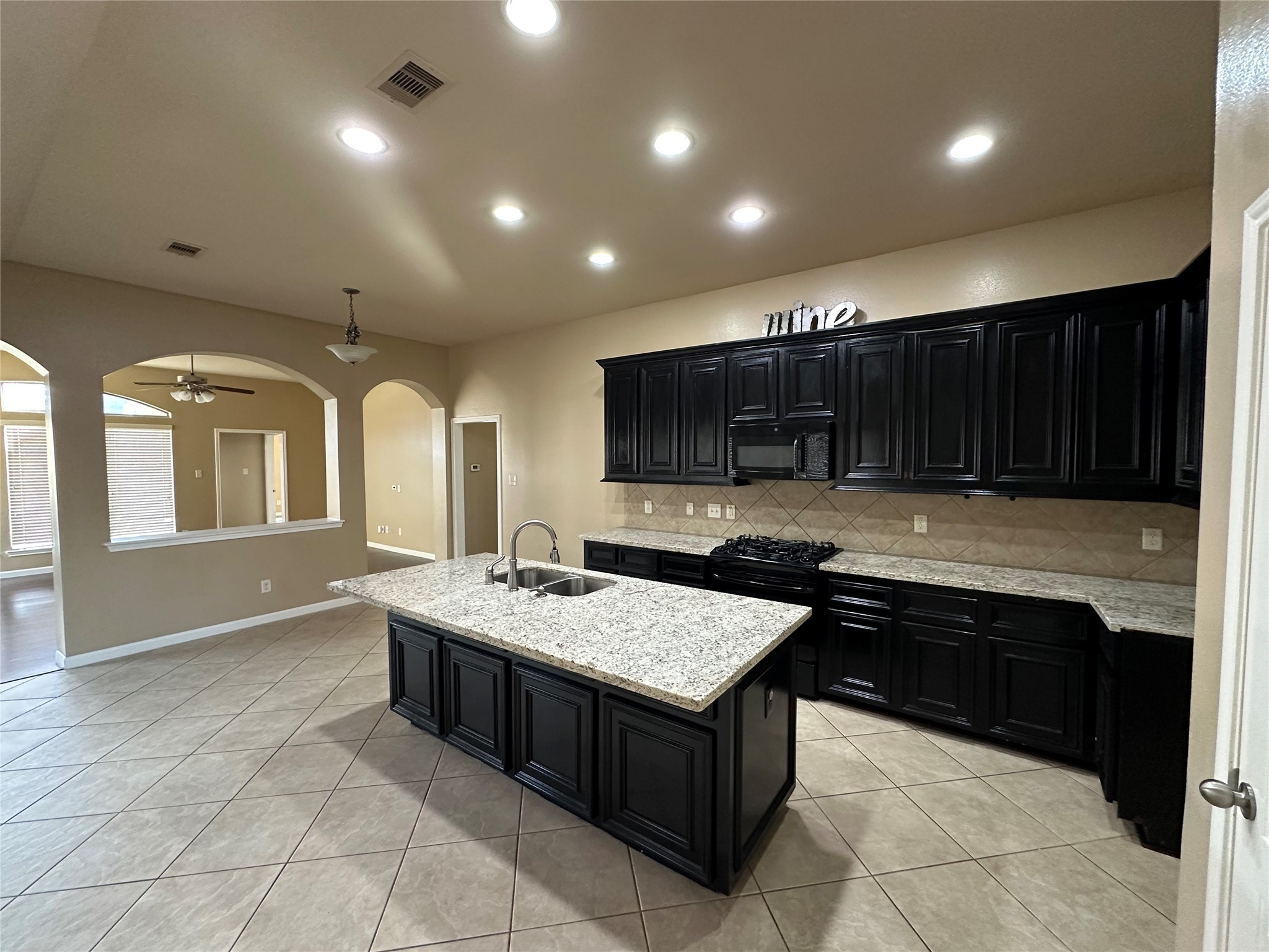 27511 Gatlin Lane Spring, TX 77386 - Photo 6 of 18 Updated kitchen with sleek finishes and a convenient breakfast bar, perfect for casual dining and everyday living.