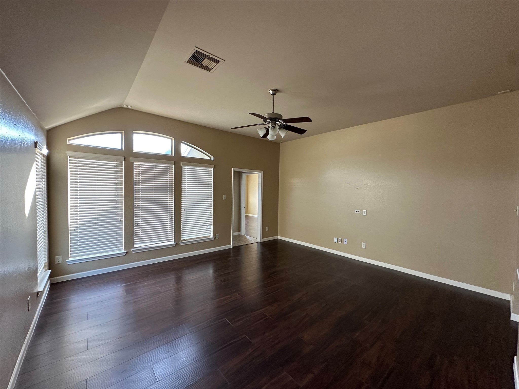 27511 Gatlin Lane Spring, TX 77386 - Photo 7 of 16 an empty room with wooden floor fan and windows