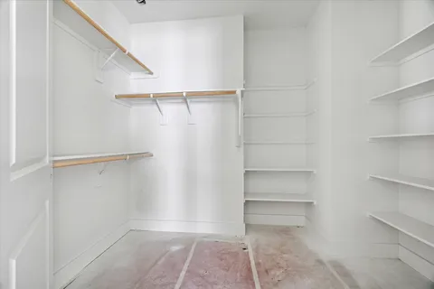 a view of an empty walk in closet