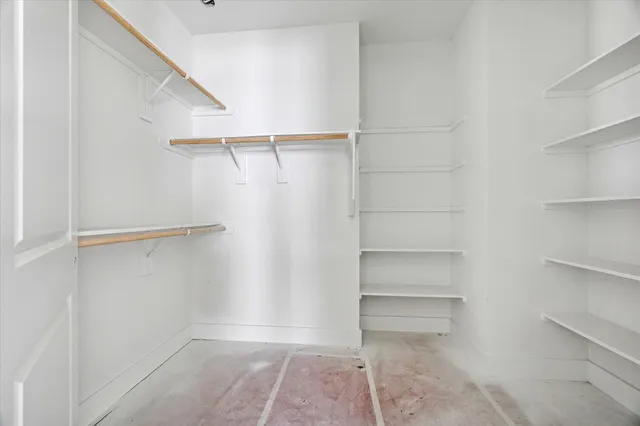a view of an empty walk in closet