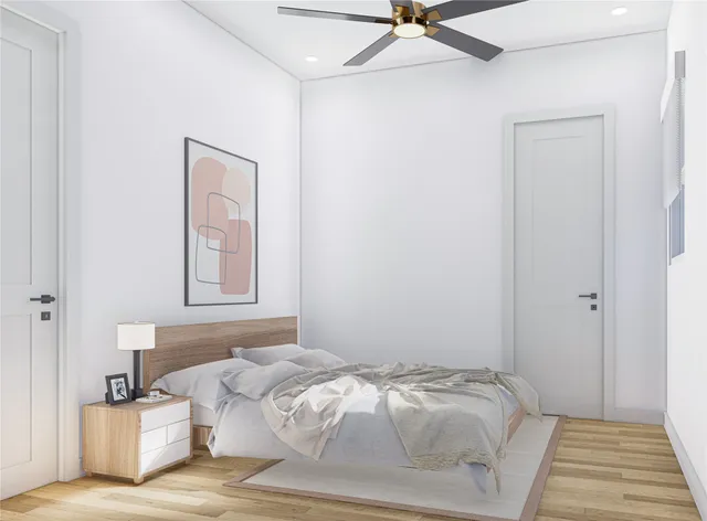 a bedroom with a bed and a window