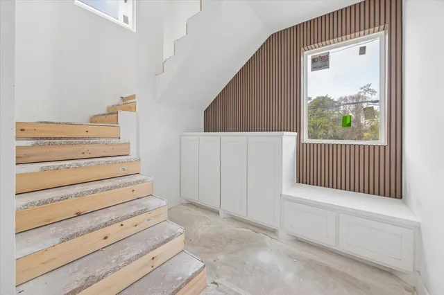 a view of entryway with stairs and wooden floor