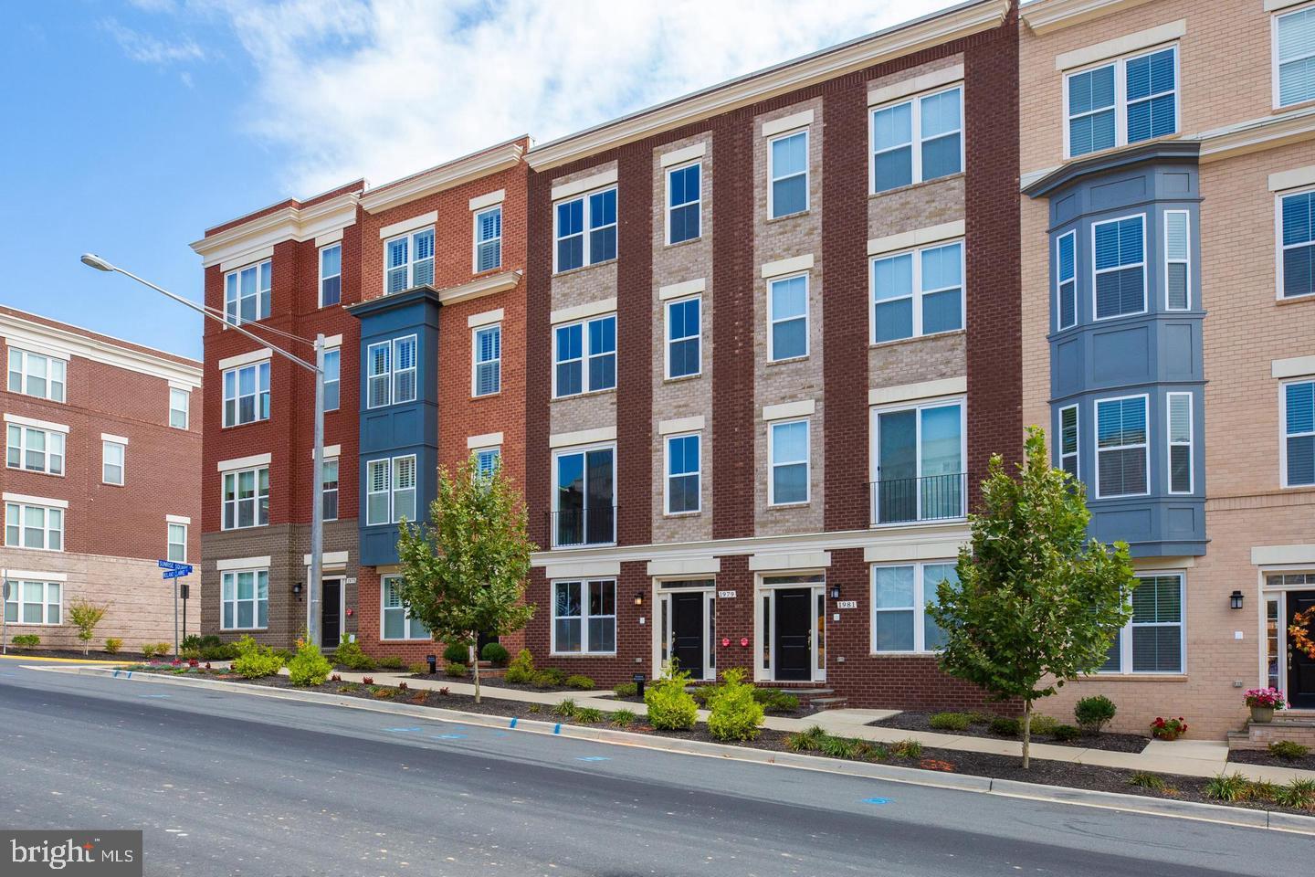 1979 Roland Clarke Place Reston, VA 20191 - Photo 1 of 52 a front view of a building with street view