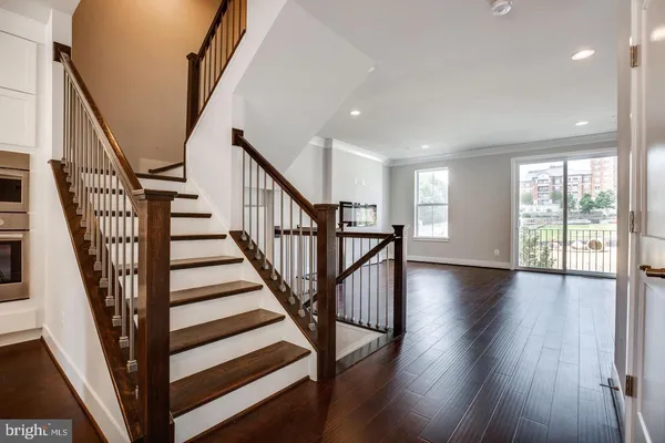 a view of a room with wooden floor