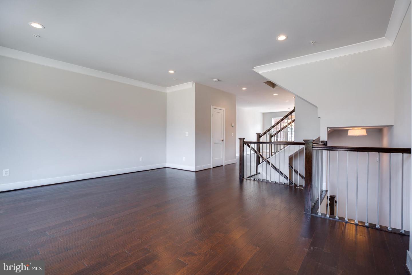 1979 Roland Clarke Place Reston, VA 20191 - Photo 17 of 52 a view of an empty room with wooden floor and a window