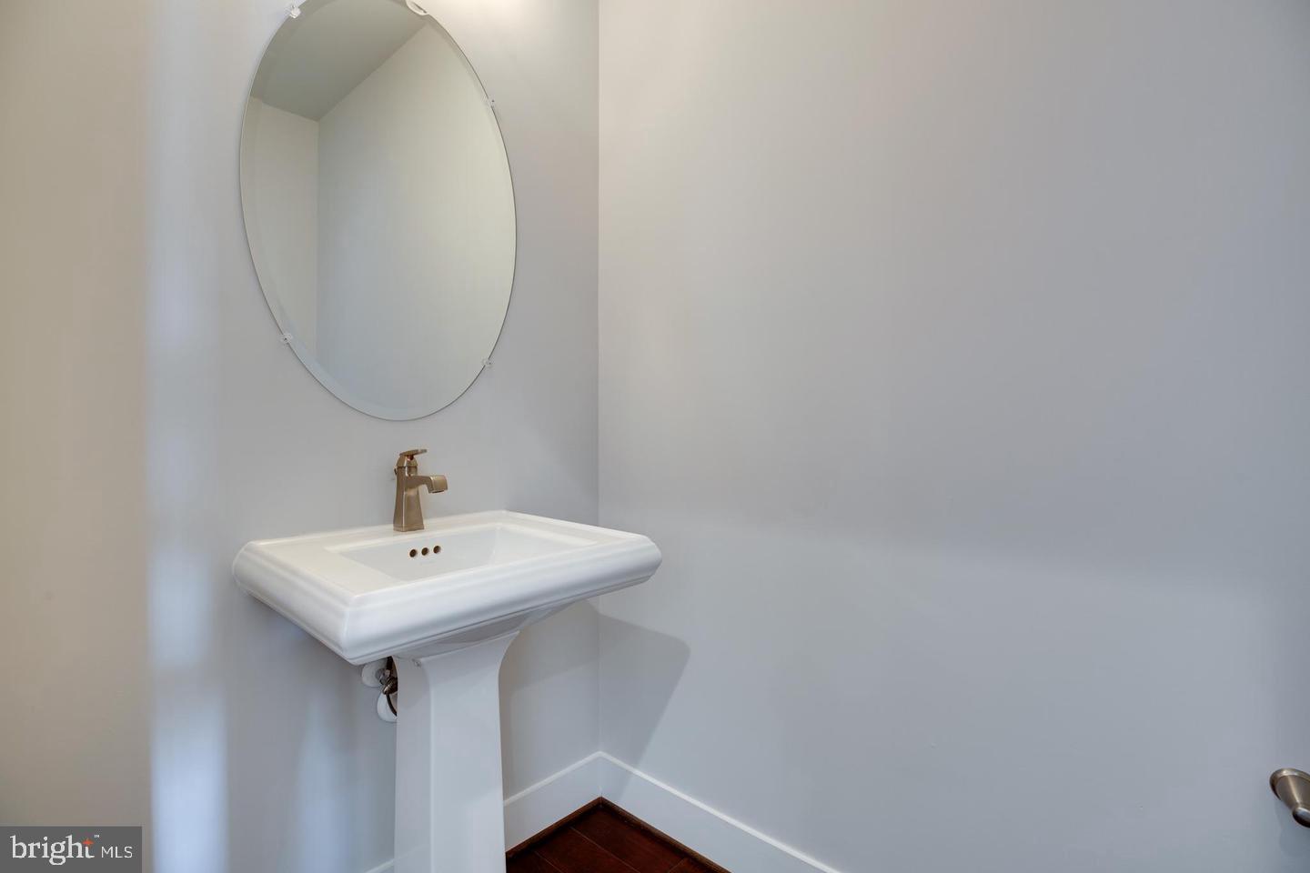 1979 Roland Clarke Place Reston, VA 20191 - Photo 18 of 52 a bathroom with a sink and a mirror