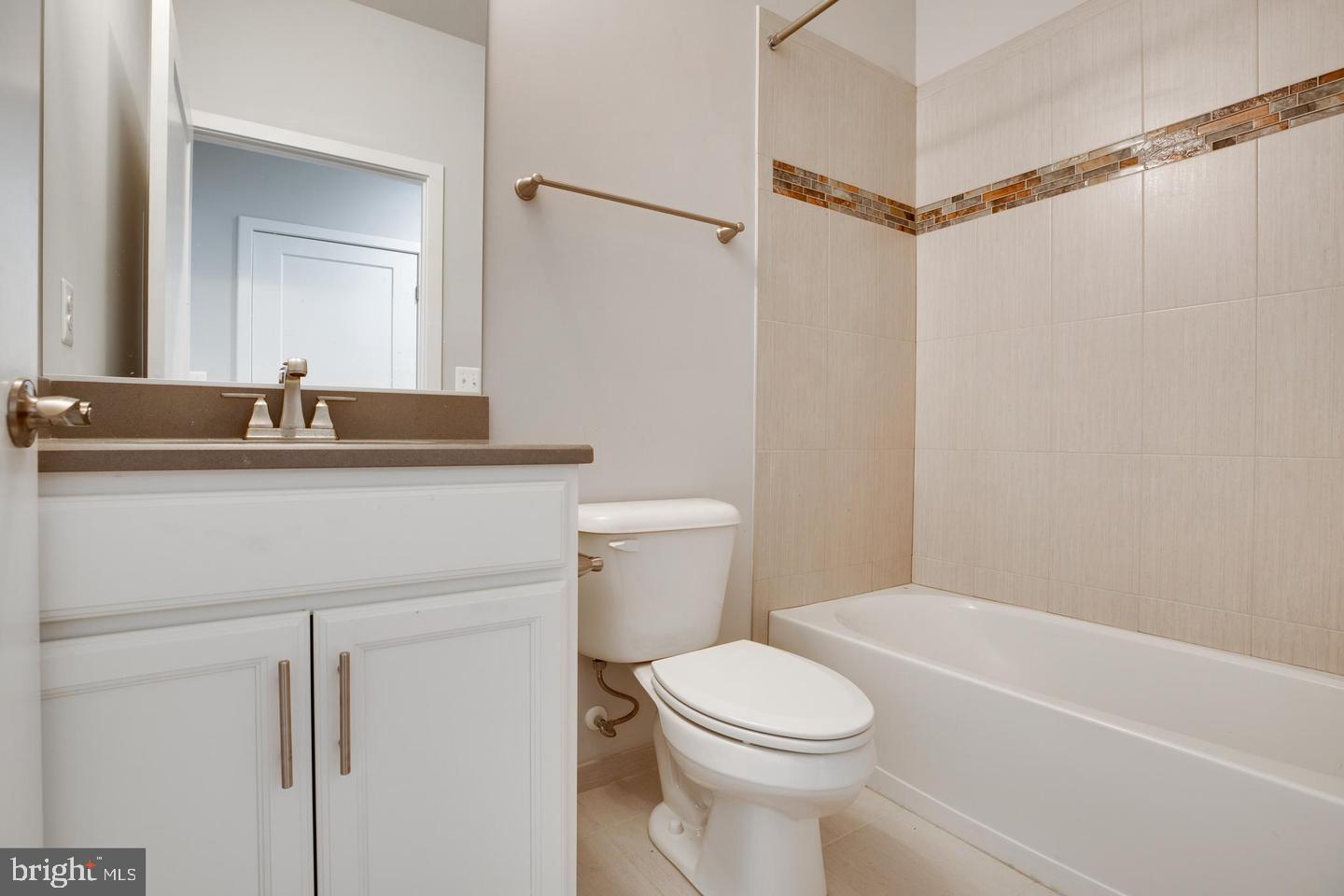 1979 Roland Clarke Place Reston, VA 20191 - Photo 21 of 52 a bathroom with a sink a toilet and shower