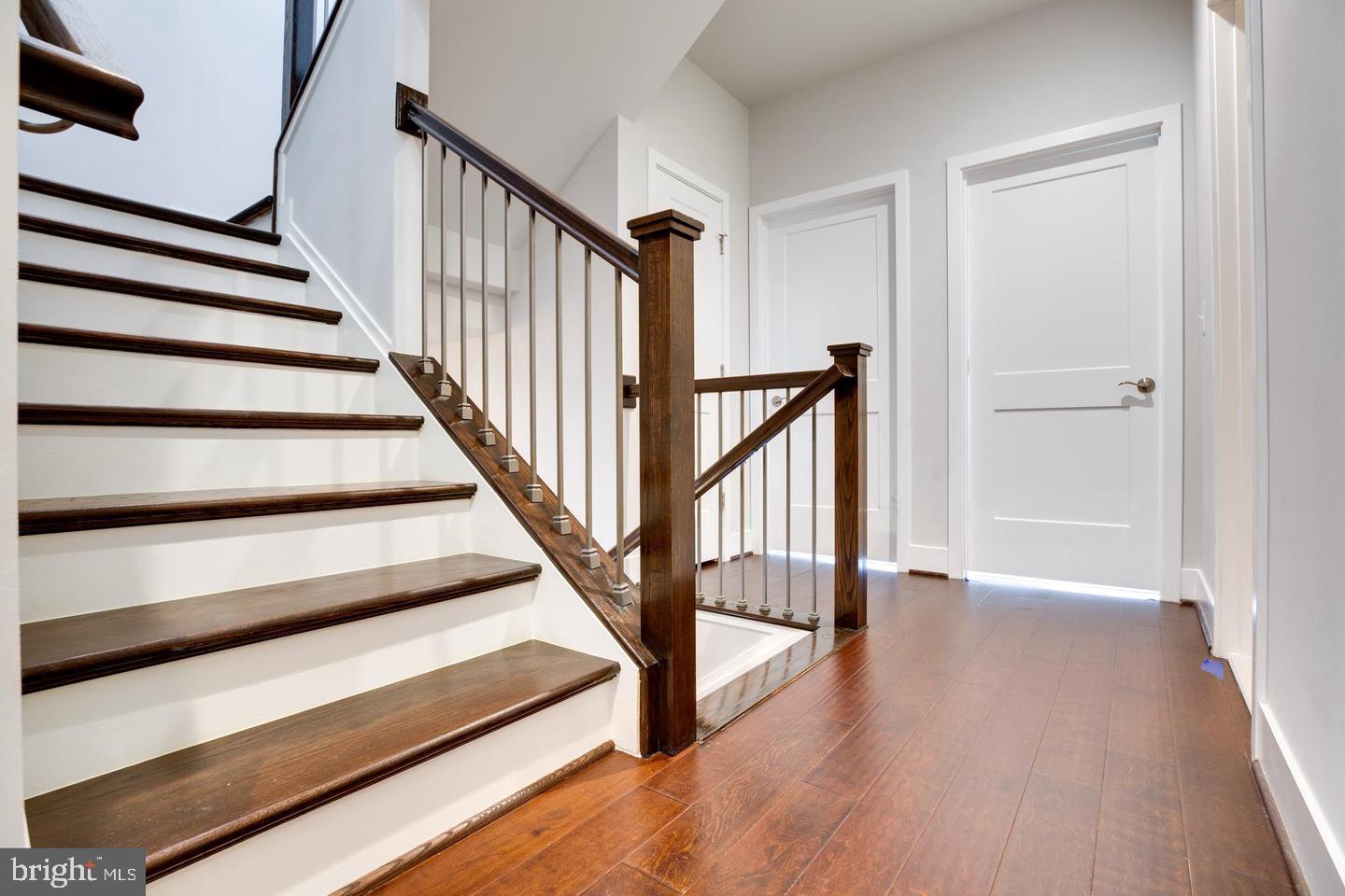 1979 Roland Clarke Place Reston, VA 20191 - Photo 23 of 52 a view of staircase with wooden floor and a rug