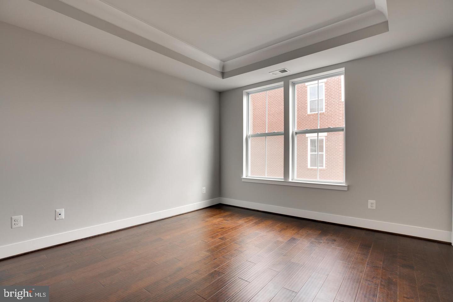 1979 Roland Clarke Place Reston, VA 20191 - Photo 24 of 52 wooden floor in an empty room with a window