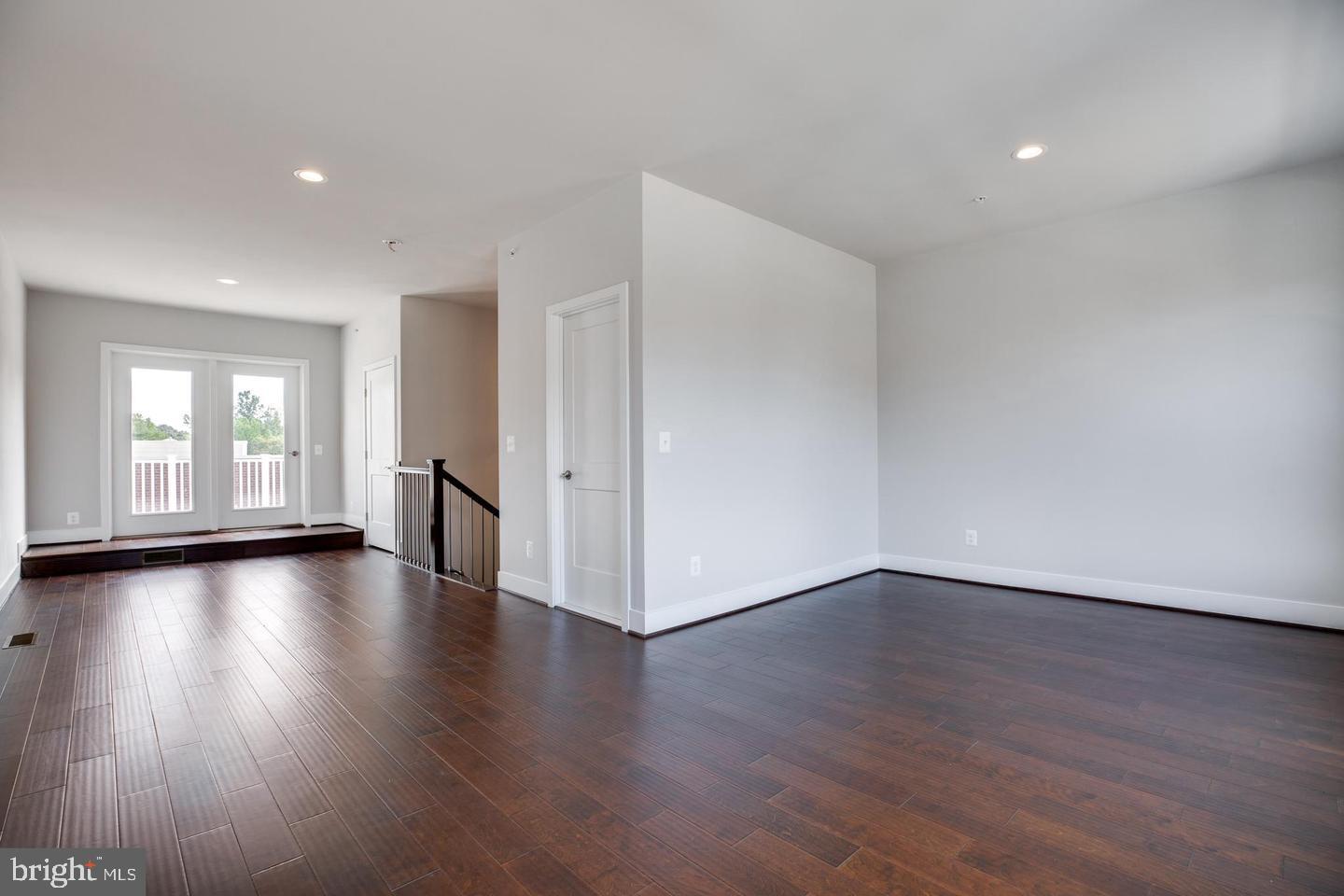 1979 Roland Clarke Place Reston, VA 20191 - Photo 36 of 52 a view of a livingroom with wooden floor and window