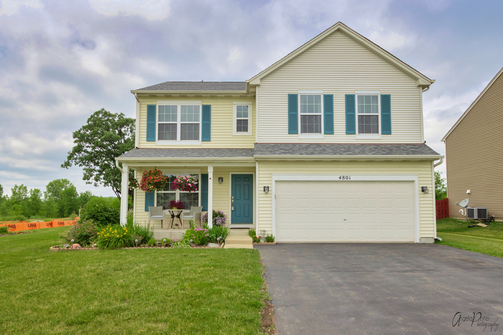 4801 Stillwater Road Wonder Lake, IL 60097 - Photo 1 of 36 a front view of a house with a yard and garage