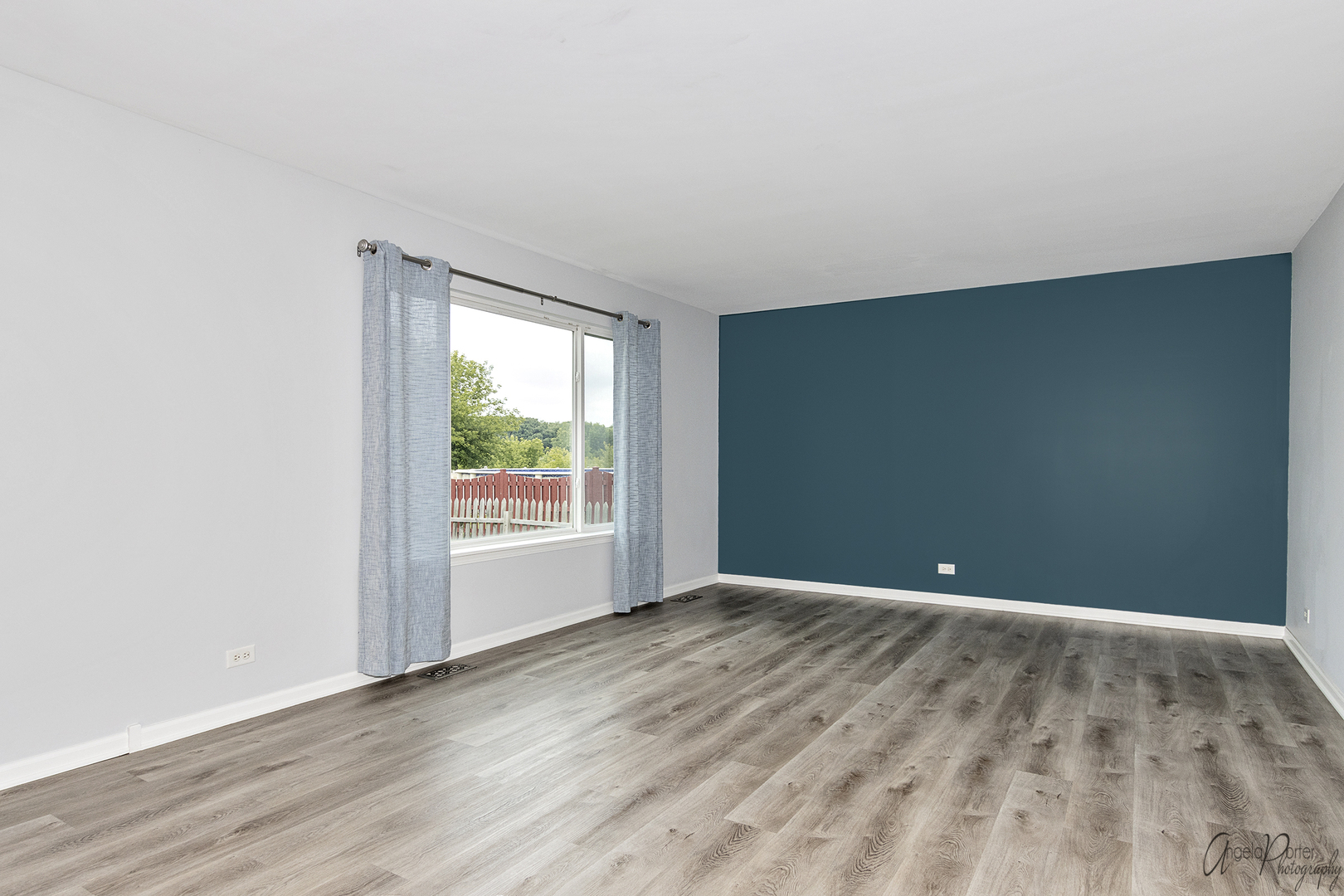 4801 Stillwater Road Wonder Lake, IL 60097 - Photo 11 of 36 a view of an empty room with wooden floor and a window