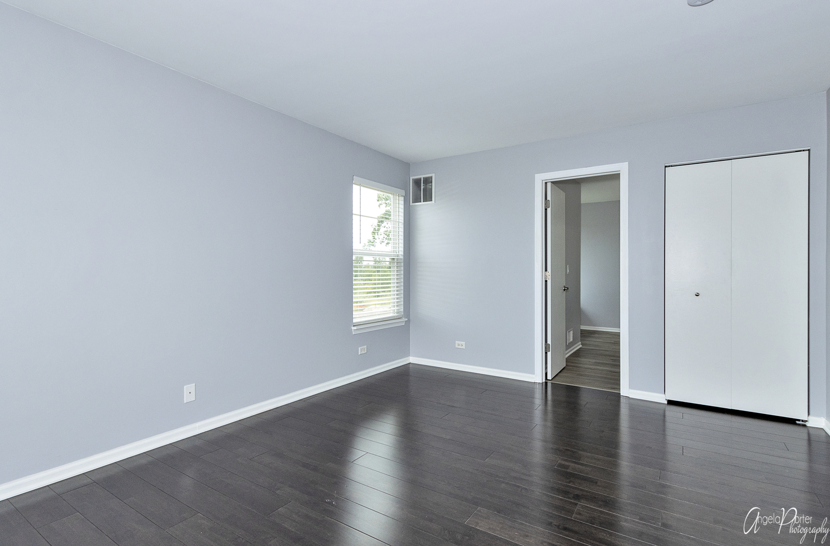 4801 Stillwater Road Wonder Lake, IL 60097 - Photo 17 of 36 wooden floor in an empty room with a window