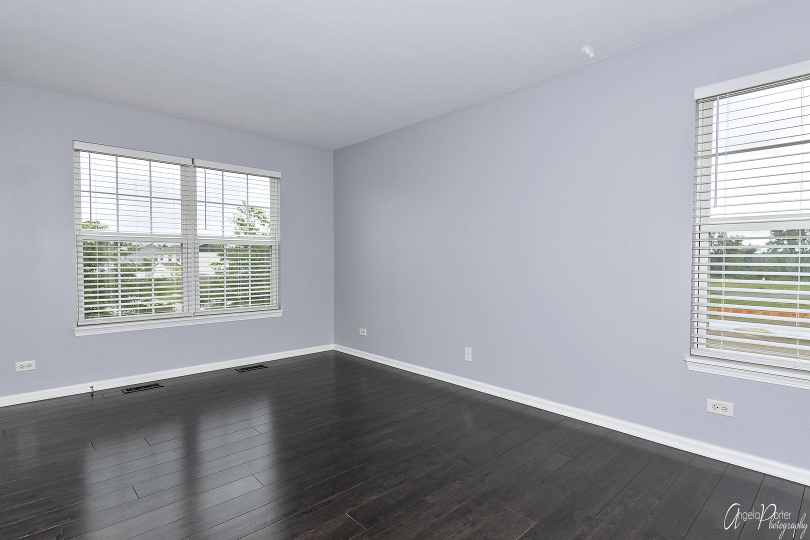 4801 Stillwater Road Wonder Lake, IL 60097 - Photo 18 of 36 a view of an empty room with wooden floor and a window