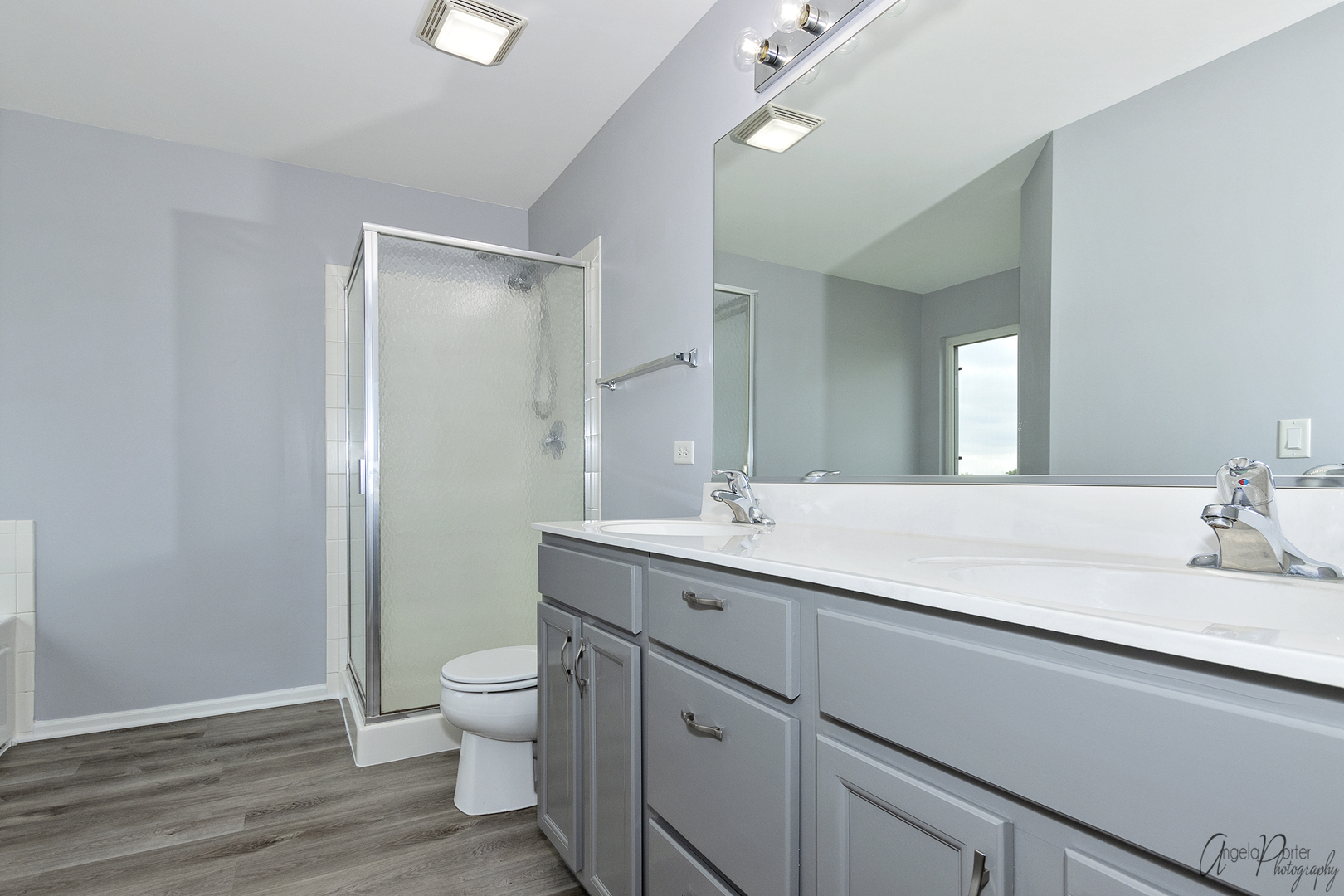 4801 Stillwater Road Wonder Lake, IL 60097 - Photo 19 of 36 a bathroom with a double vanity sink toilet and a mirror