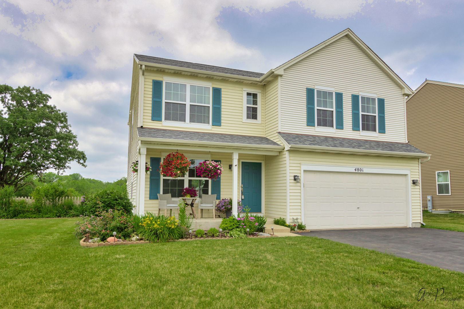 4801 Stillwater Road Wonder Lake, IL 60097 - Photo 2 of 36 a front view of a house with a yard and garage
