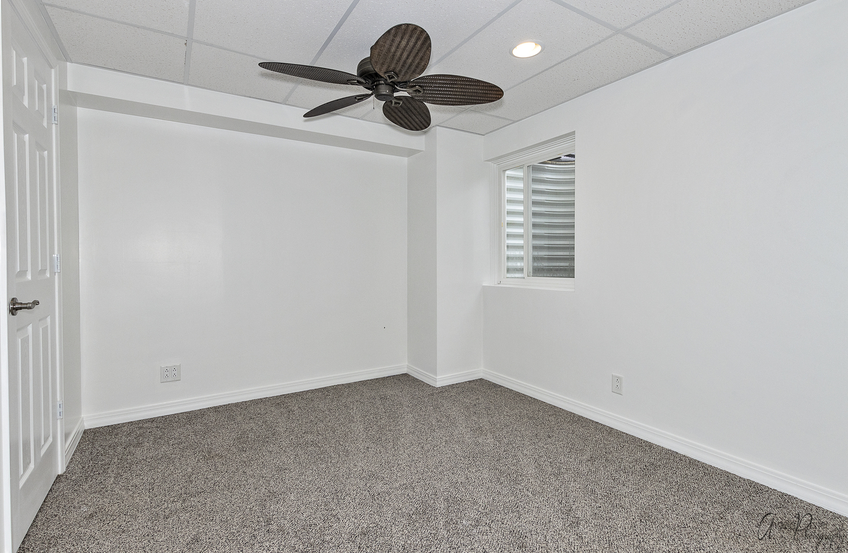 4801 Stillwater Road Wonder Lake, IL 60097 - Photo 31 of 36 an empty room with a ceiling fan and window
