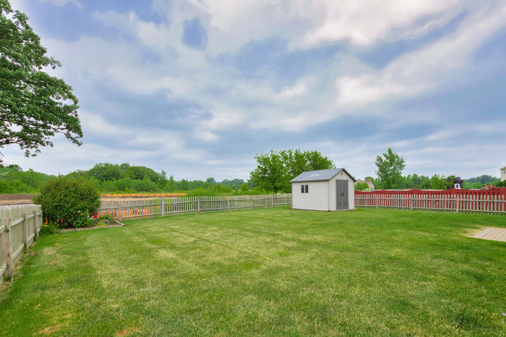 4801 Stillwater Road Wonder Lake, IL 60097 - Photo 35 of 36 a view of a big house with a big yard and large trees