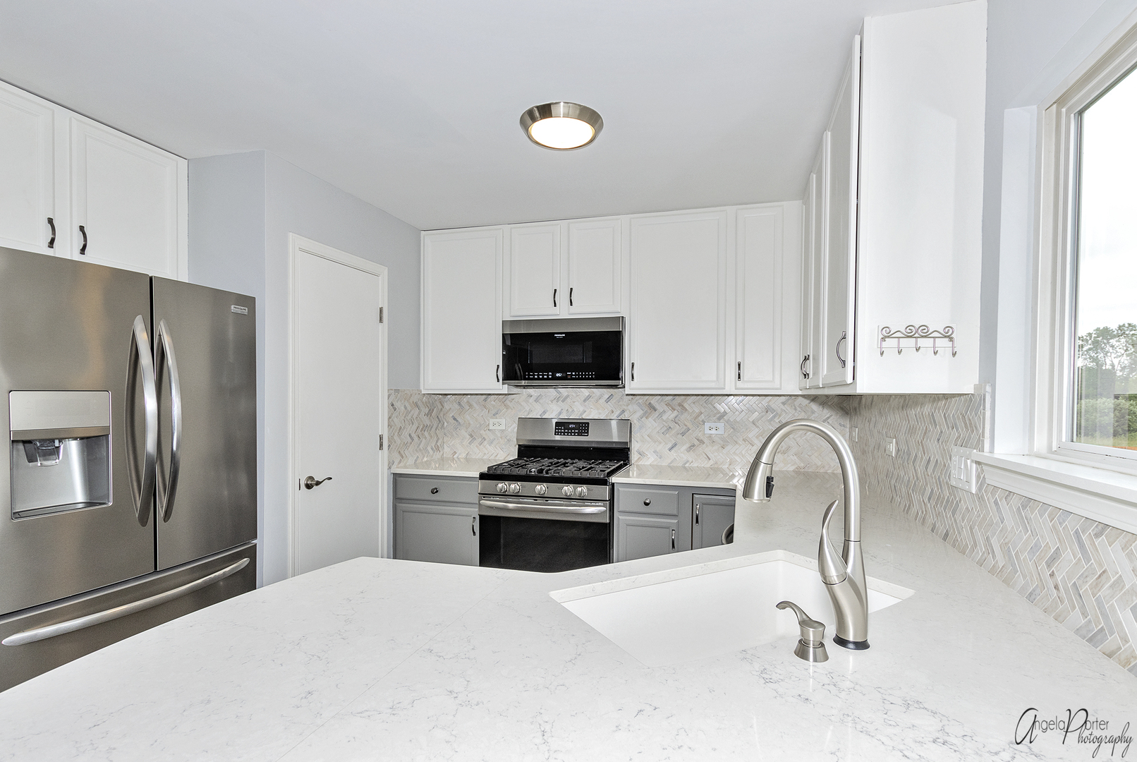 4801 Stillwater Road Wonder Lake, IL 60097 - Photo 6 of 36 a kitchen with granite countertop a refrigerator stove and sink