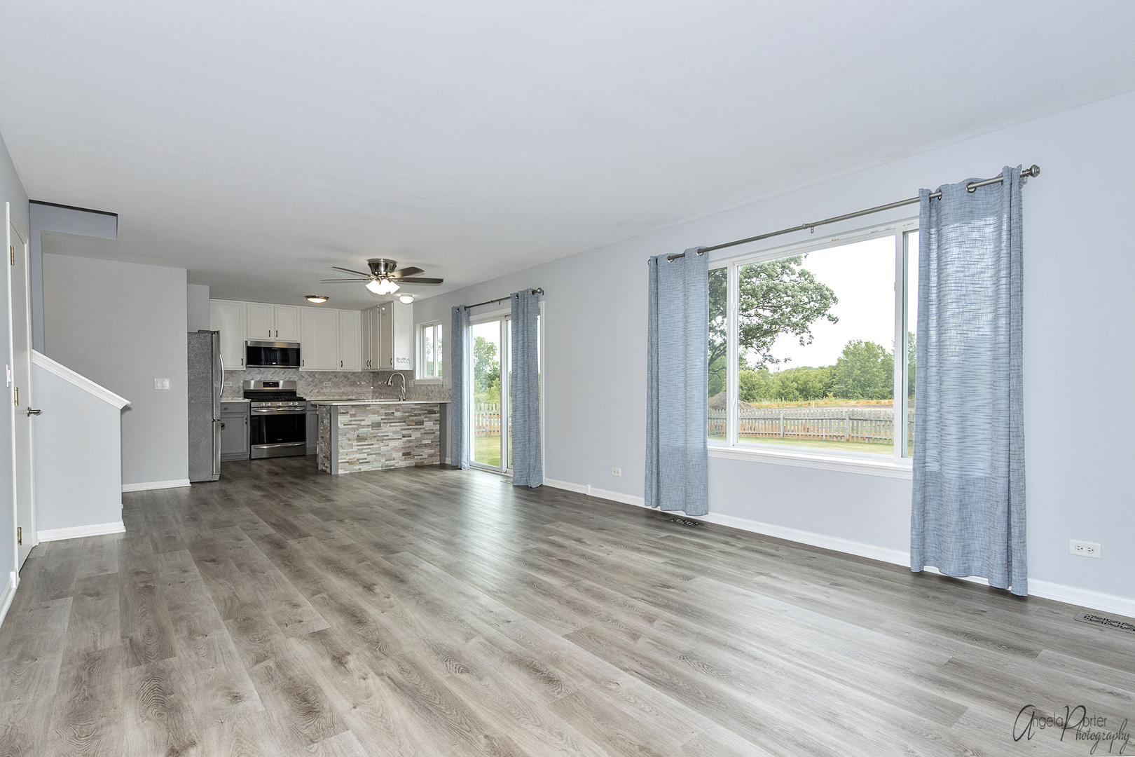 4801 Stillwater Road Wonder Lake, IL 60097 - Photo 10 of 36 a view of a kitchen with wooden floor and a window