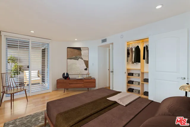 a bedroom with a bed furniture and a window