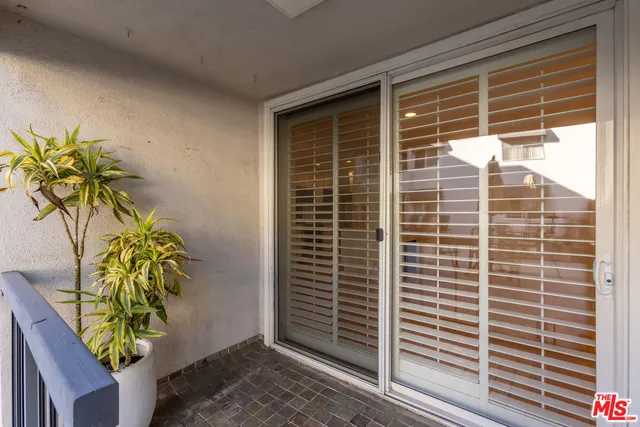 a view of a door with a bench