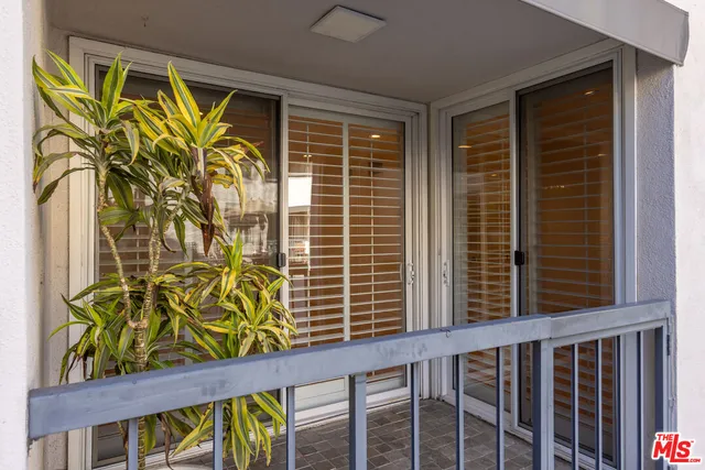 a view of a door with a wooden fence