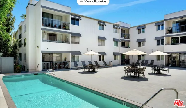 a view of a building with sitting area