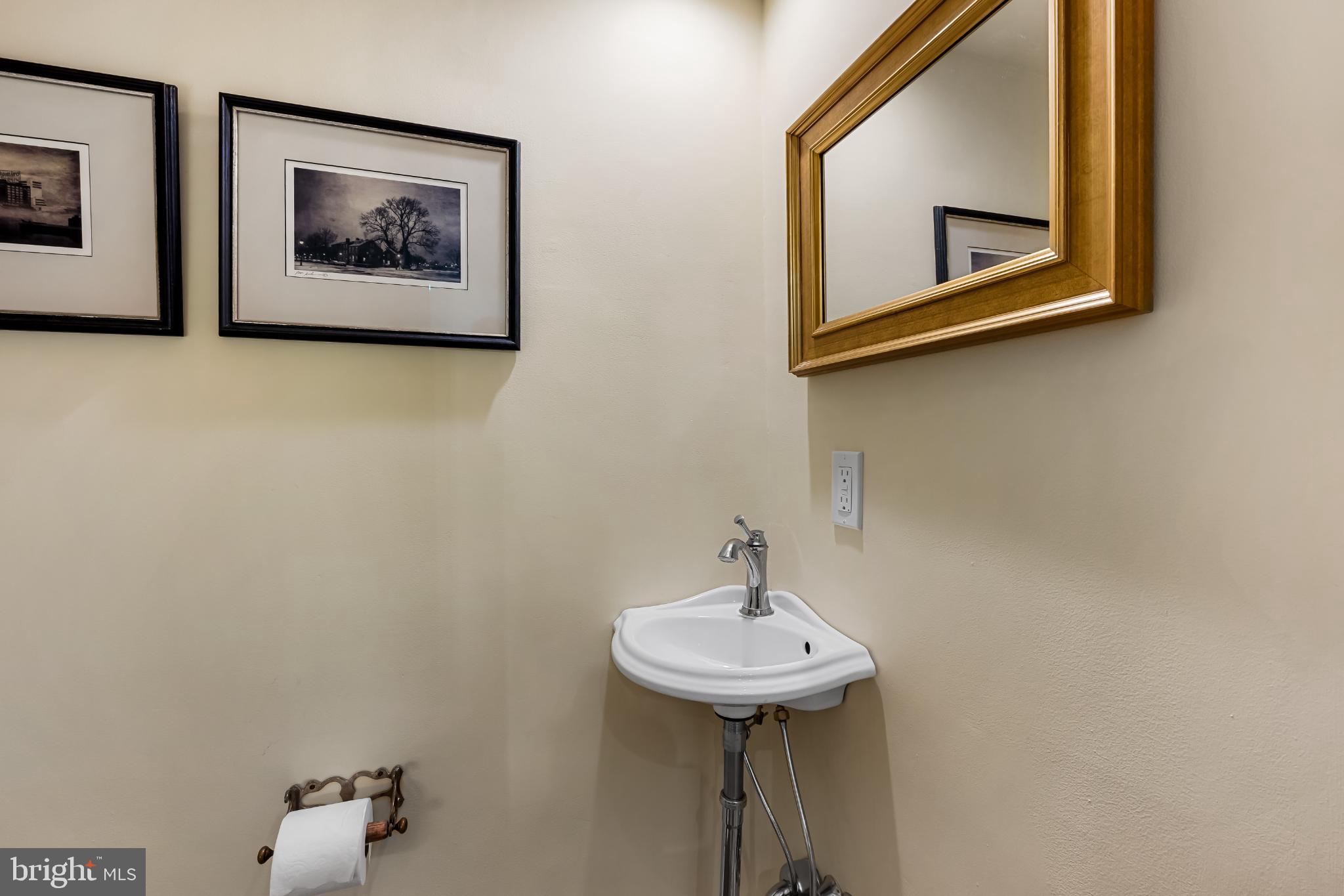 407 Warren Avenue Baltimore, MD 21230 - Photo 16 of 85 a bathroom with a sink and a mirror