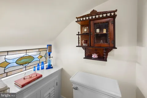 a large kitchen with stainless steel appliances a large counter top a stove and a sink