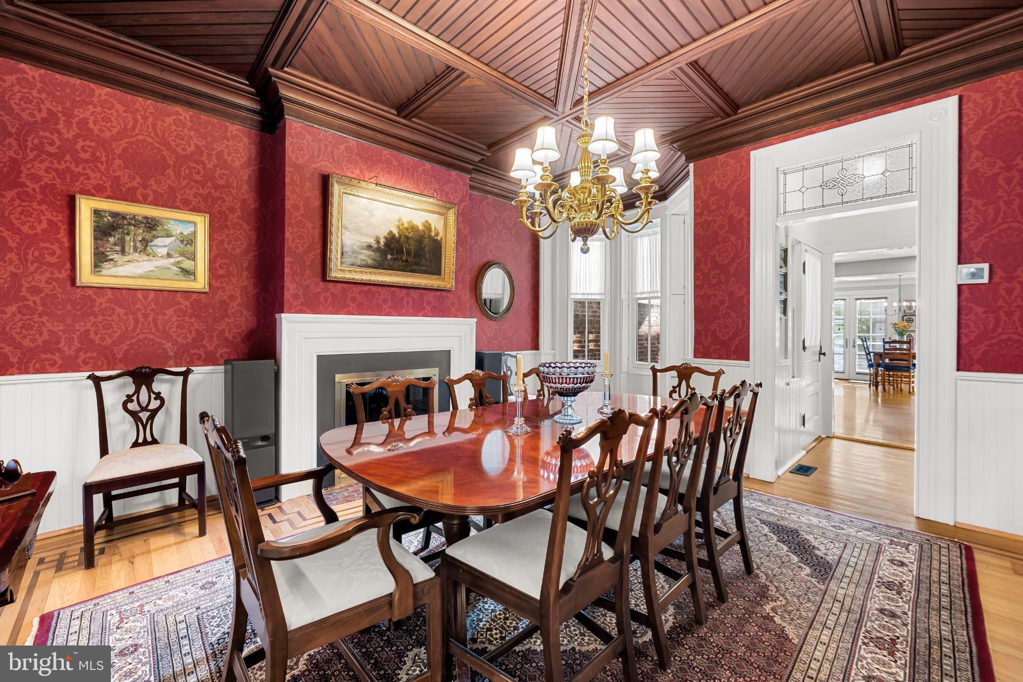 407 Warren Avenue Baltimore, MD 21230 - Photo 22 of 85 a view of a dining room with furniture a chandelier and wooden floor