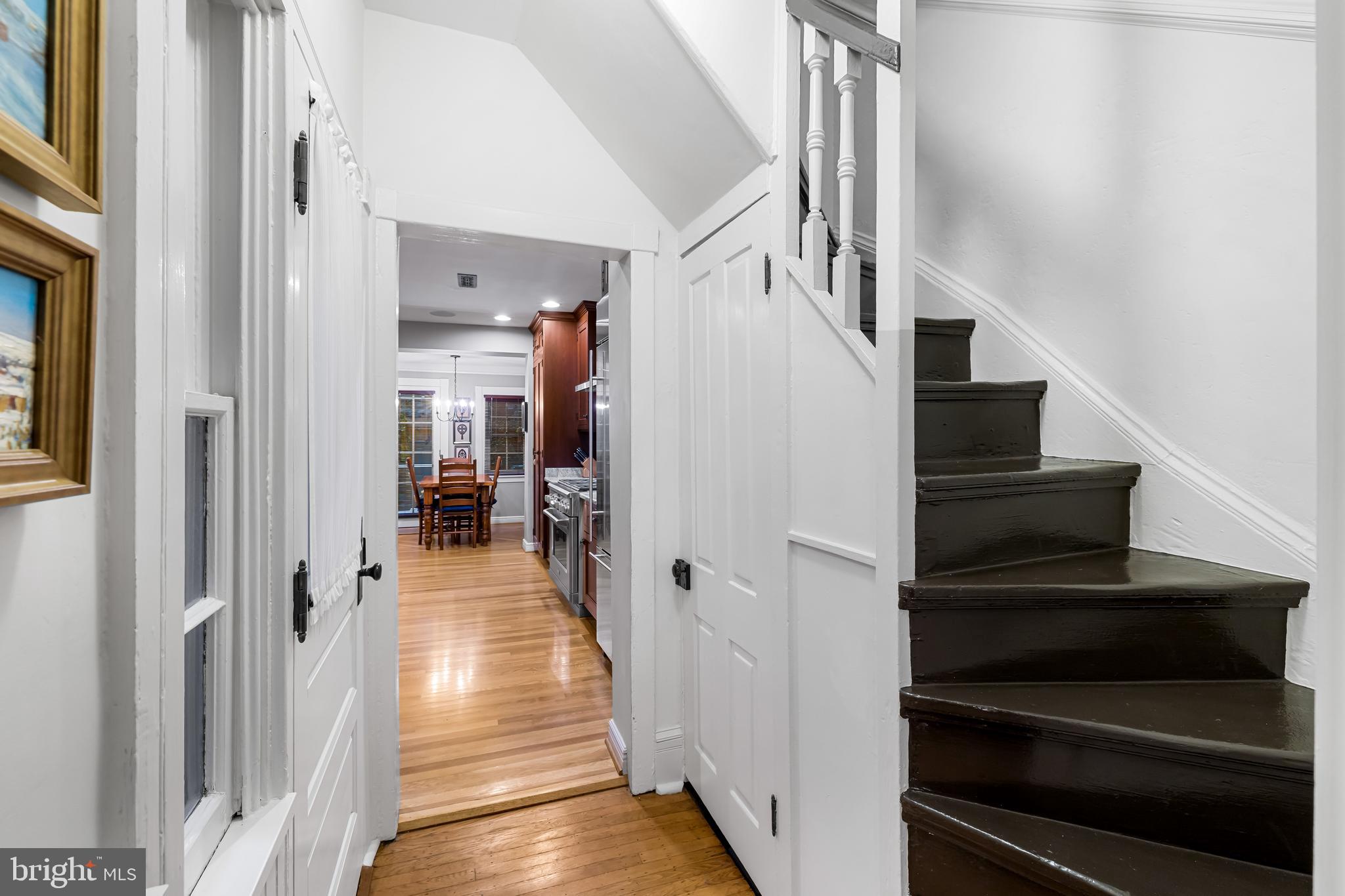 407 Warren Avenue Baltimore, MD 21230 - Photo 24 of 85 a view of a hallway with wooden floor and staircase