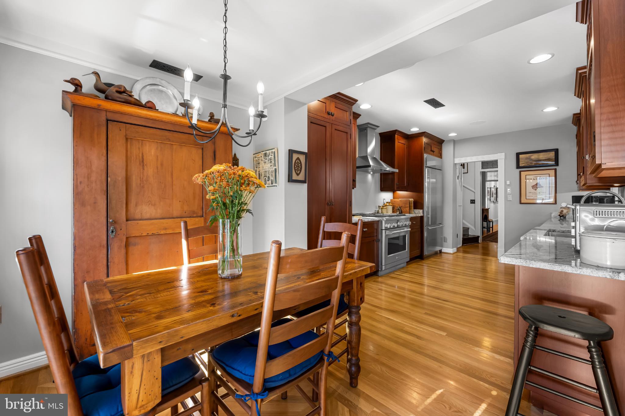 407 Warren Avenue Baltimore, MD 21230 - Photo 30 of 85 a view of a dining room with furniture and wooden floor