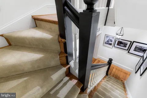 a view of a hallway with windows