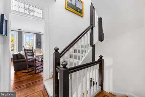 a view of a chairs and table in a balcony