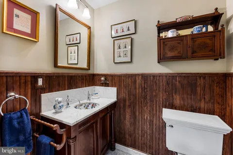 a view of a chairs and table in a back yard of the house